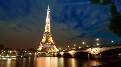 Lighting Paris Eiffel Tower With Sky And Clouds Background