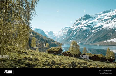 Beautiful Norwegian Landscape With Old Farm Lake And Mountains Stock