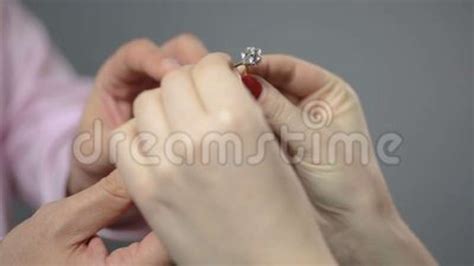 Male Presenting Engagement Ring To Beloved Woman Holding Gift And Kissing Man Stock Footage