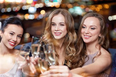 Happy Women With Champagne Glasses At Night Club Stock Photo Image Of