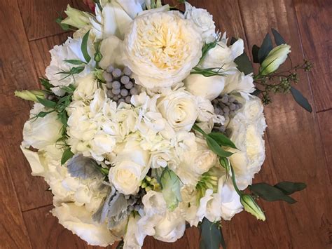 Telling love stories is what we do. White and silver bridal bouquet | Modern wedding flowers ...