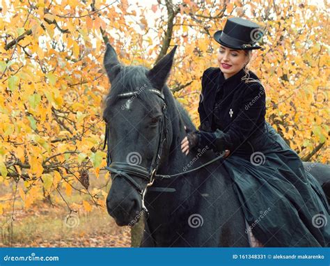 Girl In A Black Dress Riding A Black Horse Stock Image Image Of