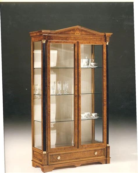 The exterior of this wooden display cabinet does feature some marks due to its age; Wooden display cabinet with 2 glass doors, classic style ...