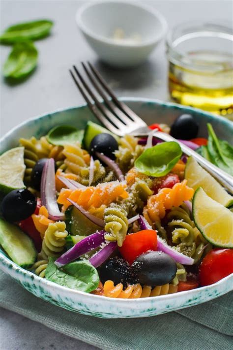 Pasta Salad With Colorful Fusilli And Vegetables In A Ceramic Plate