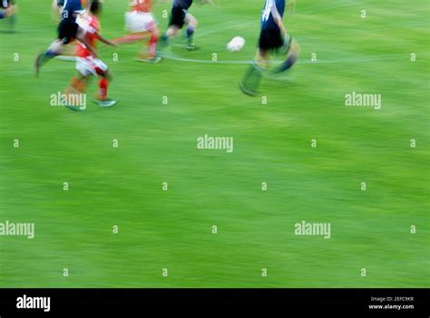 Soccer Player Playing Soccer In A Soccer Field Stock Photo Alamy