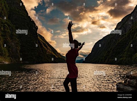A Woman Feels Happy By The Fjord Stock Photo Alamy