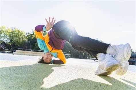 Premium Photo Asian B Boy Performs Breakdance Trick Stylish Cool