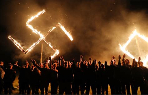 Does This Photograph Show Neo Nazis Posing Under A Burning Swastika In