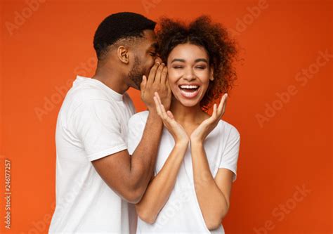 Black Man Sharing Secret With His Girlfriend Buy This Stock Photo And