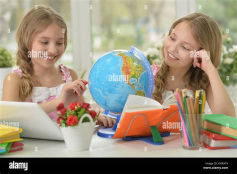Two Sisters Twins Doing Homework Stock Photo Alamy