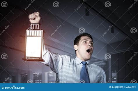 horrified businessman holding glowing lantern stock image image of looking glowing 245183053