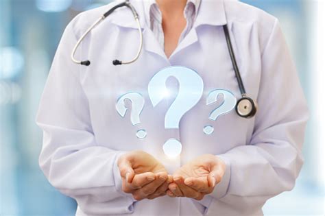 Doctor Holding A Question Mark Stock Photo Download Image Now Istock