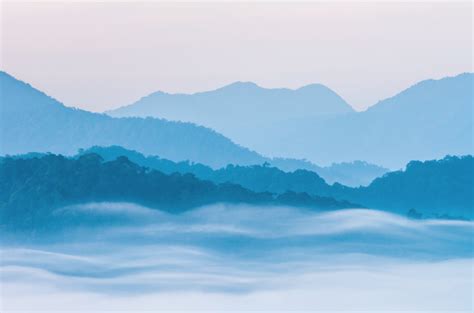 Soft Focus Of Beautiful Scenary Of Mist With Mountain