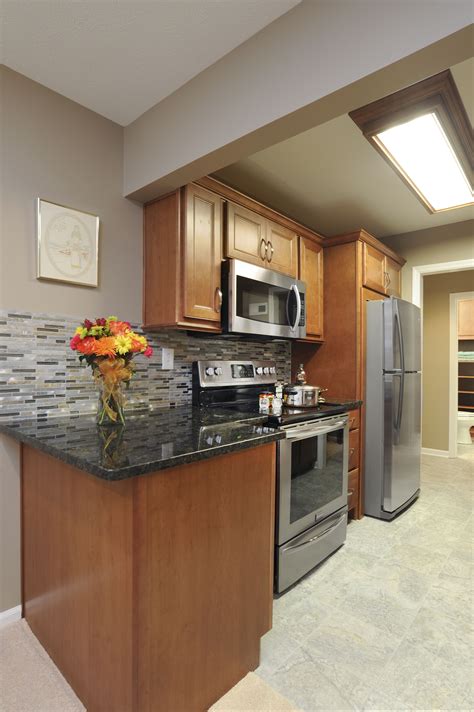From a very basic style to customized cabinetry. Homecrest Cabinetry Verde Peacock Granite Designer ...