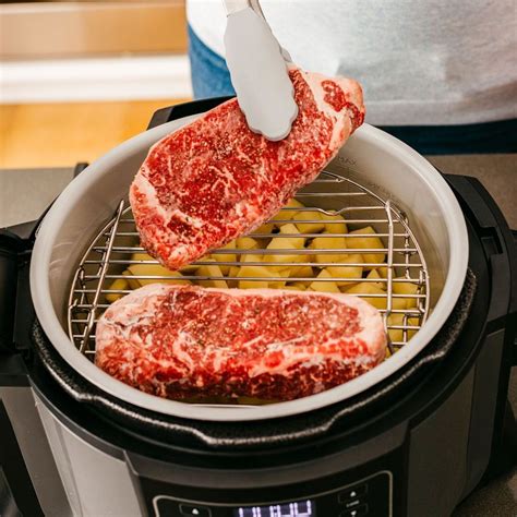 Generously rub pork steaks with pork rub, salt, and pepper. Ninja Foodi Pressure Cooker is Oven, Steamer, Air Fryer & More