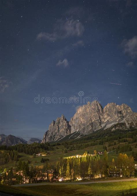 Starry Night With Mountain Peak And Town Cortina D`ampezzo In Dolomites