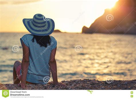 Woman Wearing Hat Admire The Sunset Over The Sea Stock Image Image Of Dawn Outdoor 80244455