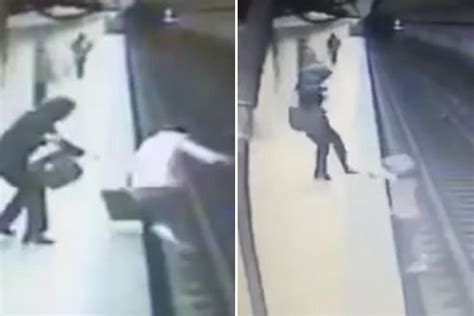 Horrifying Moment Woman Is Pushed In Front Of Train By A Female Maniac Who Kicks Her Back Down