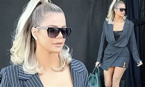 Khloe Kardashian Puts On A Leggy Display In Pinstripes As She Leaves A