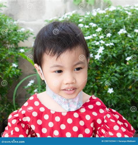 Asian Girl Little Preschooler Child Wearing Safety Face Mask Under