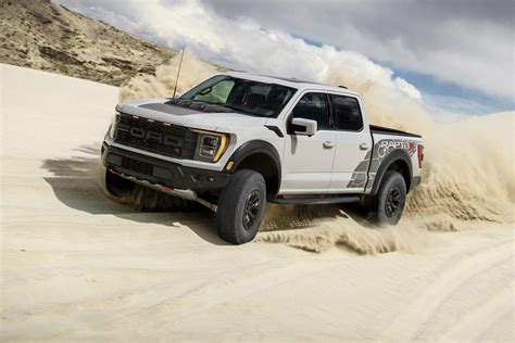 2023 Ford F 150 Raptor R Vs Ram 1500 Trx V8 Mega Trucks Compared Cnet