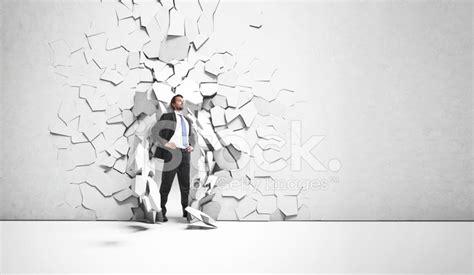 Businessman Breaks Trough A Wall Stock Photo Royalty Free Freeimages