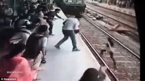 woman hit by train in mumbai survives daily mail online