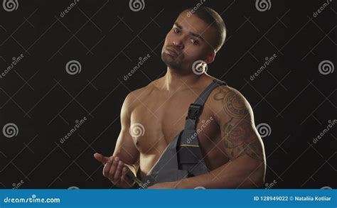 Fierce Muscular Ripped Mechanic In Workwear Threating You With A Wrench Stock Photo Image Of