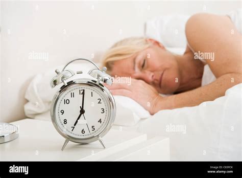 Mature Woman Asleep In Bed Stock Photo Alamy