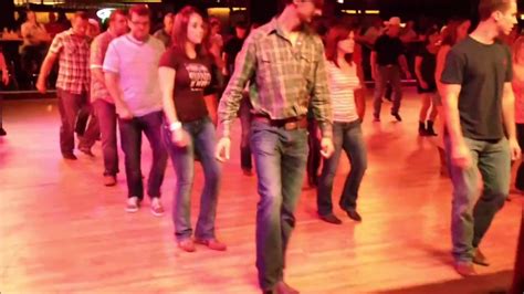 People Line Dancing To Boot Scootin Boogie Performed Live By The