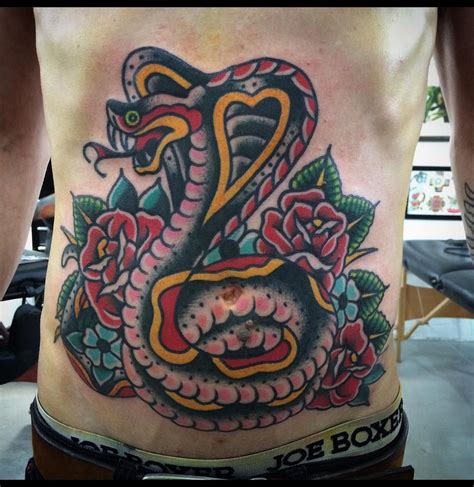 Whether they are combined with roses, skulls, and daggers in the traditional american style, or used a part of elaborate floral, combined with a mandala, feather, moon, phoenix, or geometric tattoo art, they are a flexible element with a rich symbolicism. Cobra snake tattoo - traditional tattoo | American traditional tattoo, Tattoos, Traditional tattoo