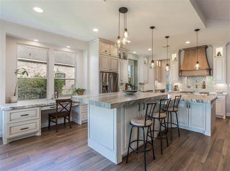 This kitchen uses white, black, and brown hues for the interior design. Transitional Modern Farmhouse Kitchen Design - Home Bunch ...
