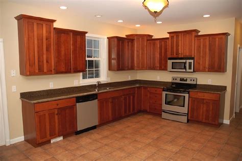 The standard height for upper cabinets has changed somewhat over the years. Bourbeau Custom Homes Inc.