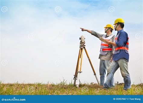 Surveyor Engineer Making Measure With Partner Stock Image Image Of