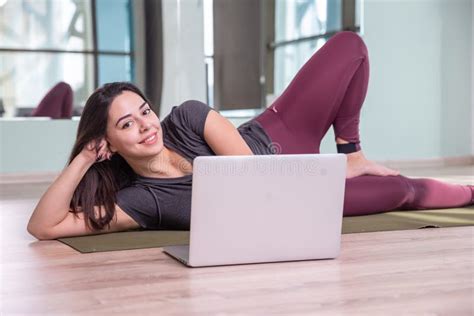 Photo Of Young Woman Practicing Yoga With Laptop Indoor Beautiful Girl Practice Yoga In Class