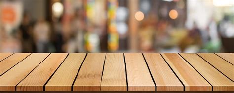 Cropped Wood Table Top On Blur Bokeh Shopping Mall