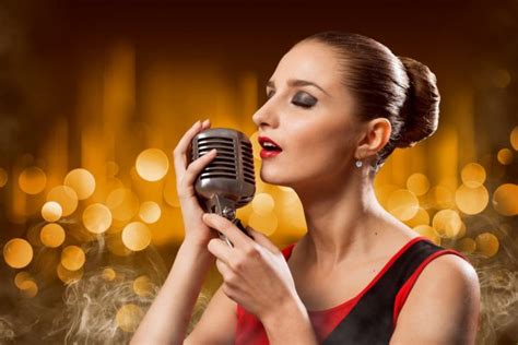 Attractive Female Singer With Microphone Stock Photo By ©khakimullin