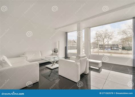 A Living Room With White Furniture And A Large Window Editorial Stock