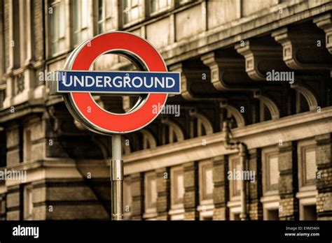 London Uk The Famous London Underground Logo Above A Station In