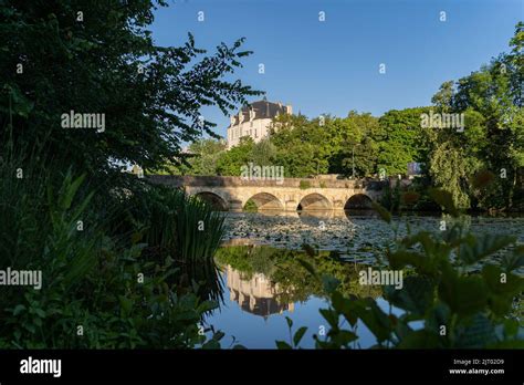 Castle Raoul And Bridge With Reflection In Water Chateauroux City