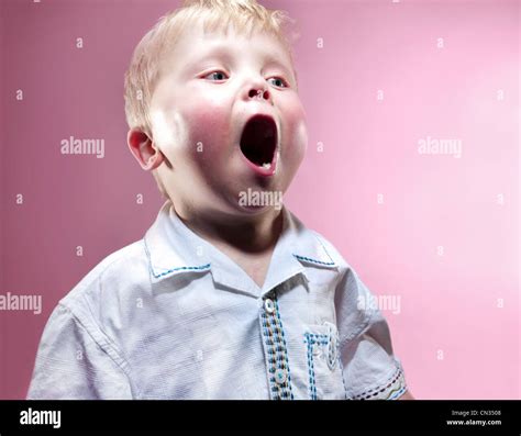 Young Boy Yawning Stock Photo Alamy