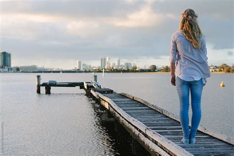 Girl Standing On A Jetty By Stocksy Contributor Jacqui Miller Stocksy