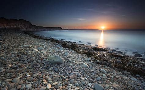 Shore Beach Sunset Rocks Stones Hd Wallpaper Nature And Landscape