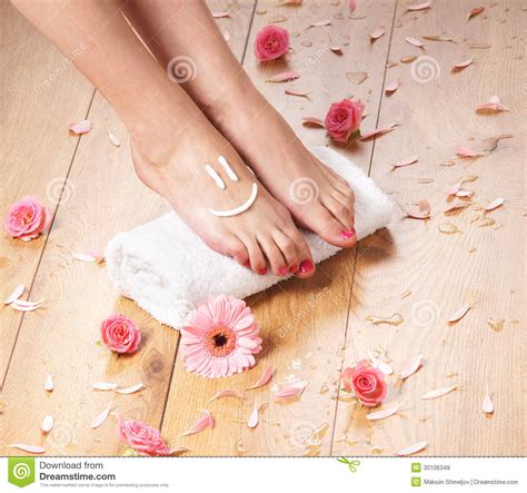 Female Feet A White Towel And Petals On The Floor Stock Image Image