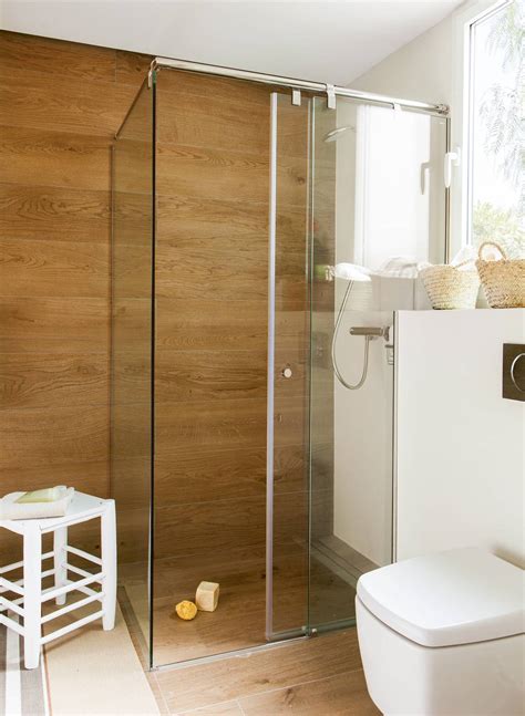 Alternativamente, un piso de ducha se puede personalizar en una bandeja o colocar en una sola pieza de pizarra maciza. Platos de ducha a ras de suelo