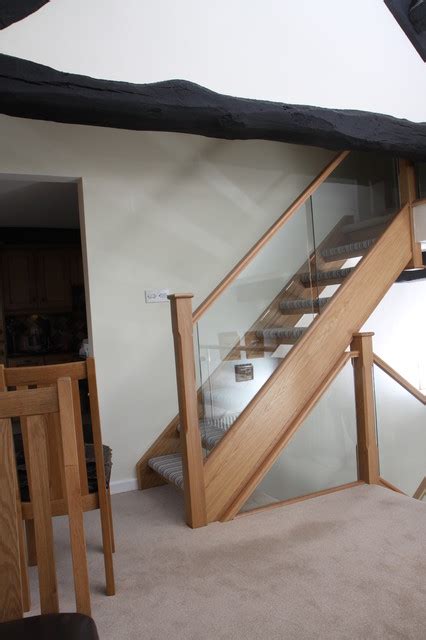 Open Tread Oak Staircase Renovation With Embedded Glass Balustrade