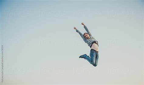 Young Man Jumps In Air By Rob And Julia Campbell Stocksy United
