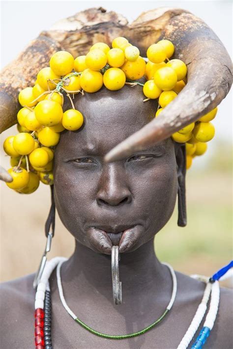 Africa Portrait Of A Mursi Woman Wearing A Traditional Headdress Lip Piercing And Beaded
