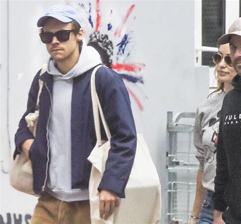 Harry Styles Carries Olivia Wildes Bags For Her As They Stroll Through