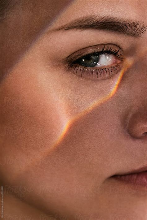 Close Up Of Womans Face With Light Under Eye By Stocksy Contributor
